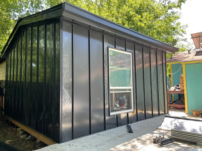 Black standing seam metal wall panels for Roof Inspection in Bonita